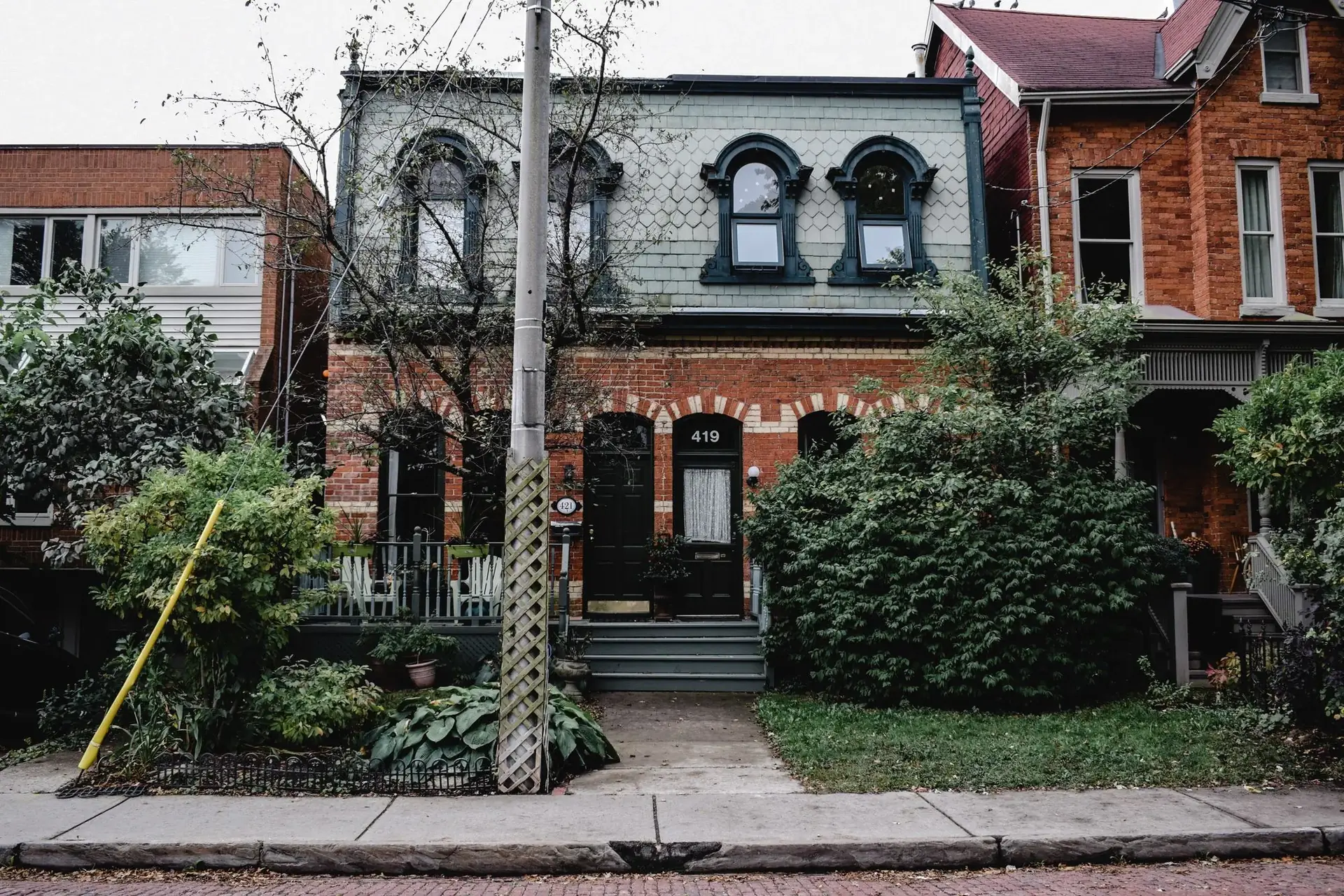 Victorian brick houses with slate roofs on a Toronto street